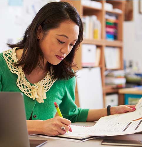 a teacher writing in classroom